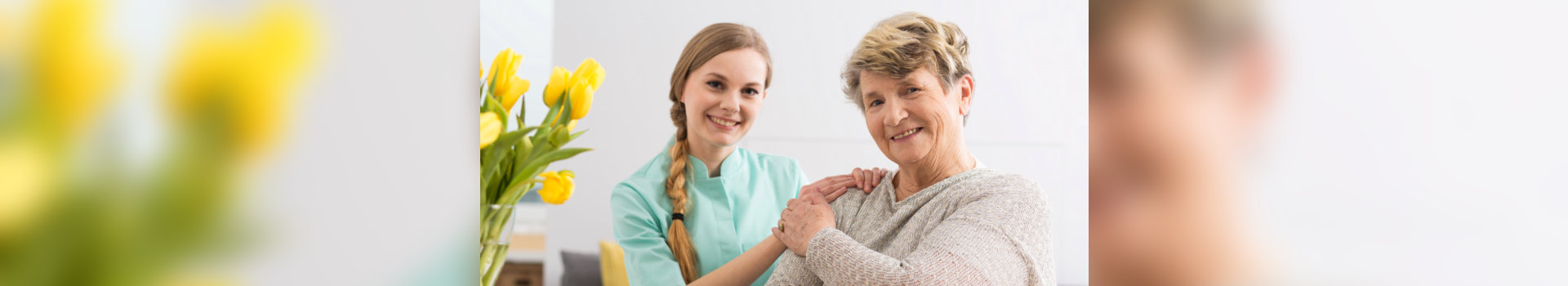 caregiver and elder smiling